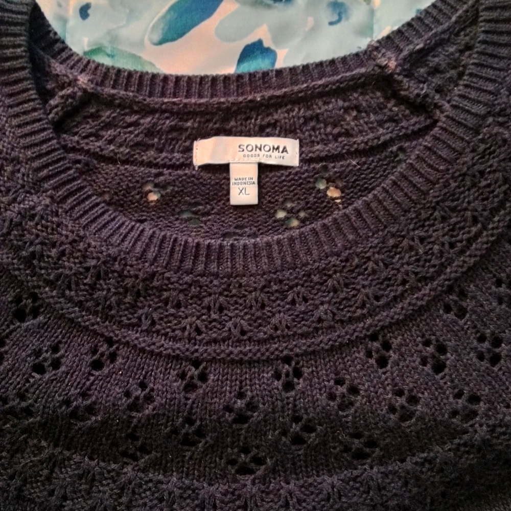Navy soft loose sweater with filigree around shoulders